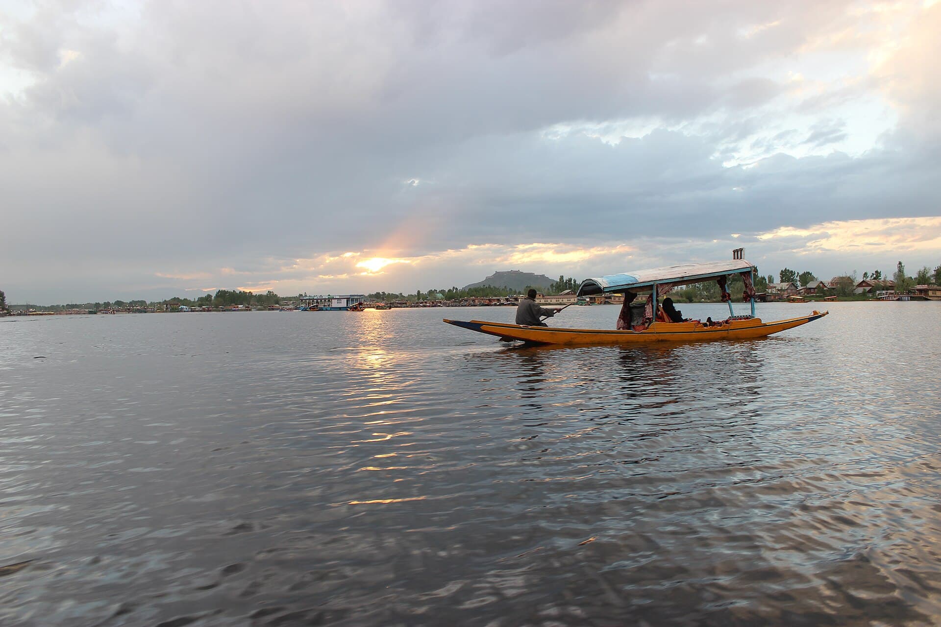 Sunset light over Dal Lake with a lone shikara, Srinagar